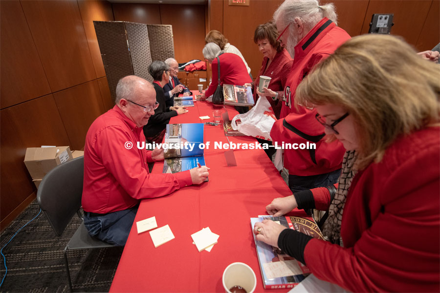 Book signing with Craig Chandler, Kim Hachiya, and Ted Kooser. Everyone was invited to enjoy a cupcake and join in the festivities with their Husker friends at the Wick Alumni Center, Friday February 15th. The Nebraska Charter was available to view, along with other historical items. Copies of Dear Old Nebraska U could be purchased and signed. Charter Day at the Wick Alumni. February 15th, 2019. Photo by Gregory Nathan / University Communication.